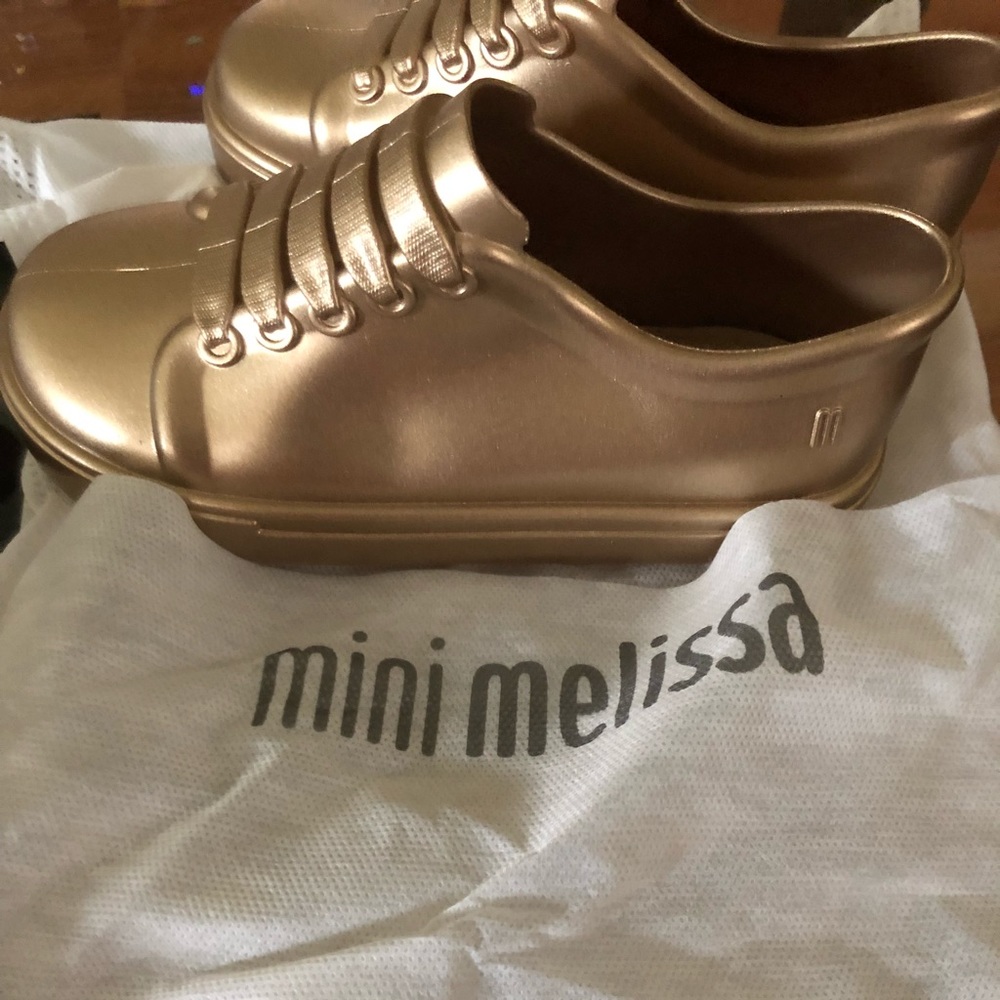 Mini Melissa gold shoes. Super cute